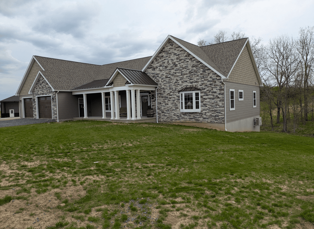 View of a house with a porch and window, asking about tree placement.