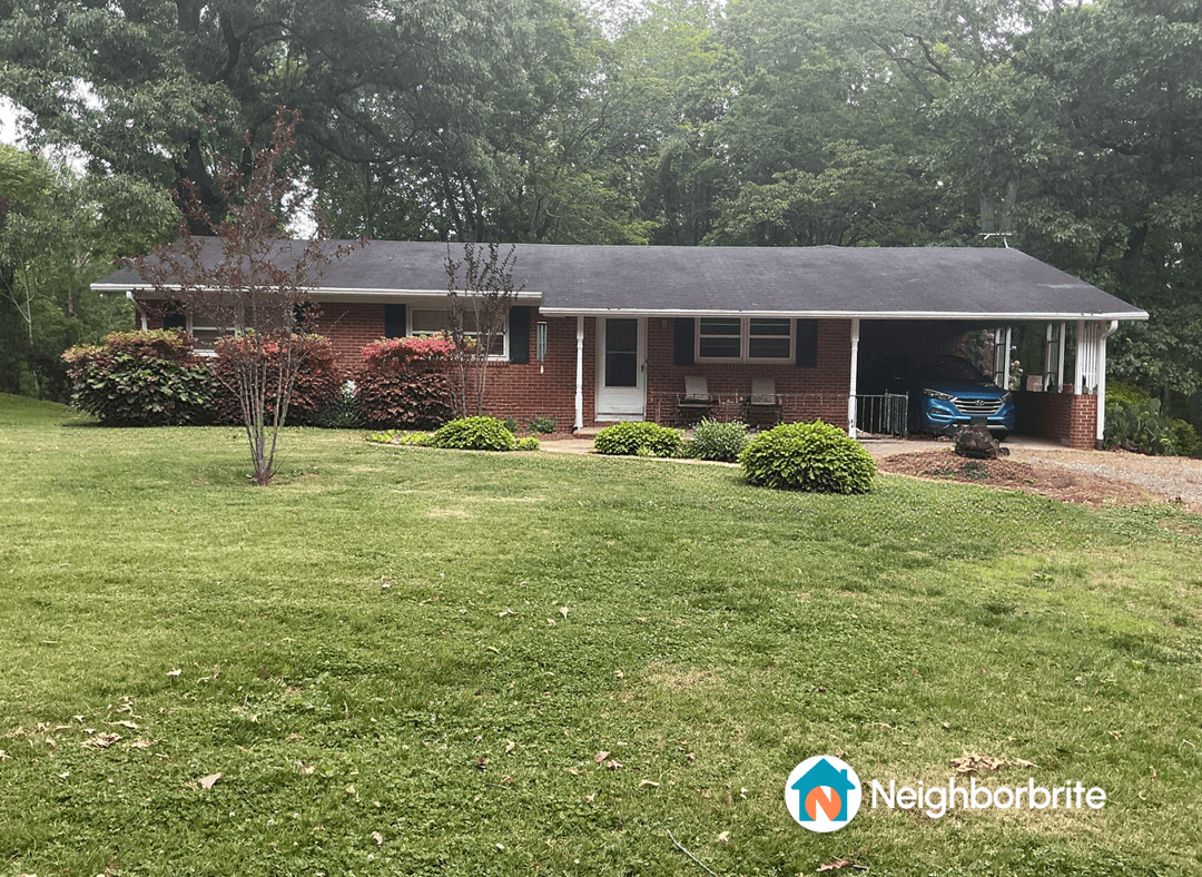 Front yard with azaleas near the house, seeking replacement ideas.