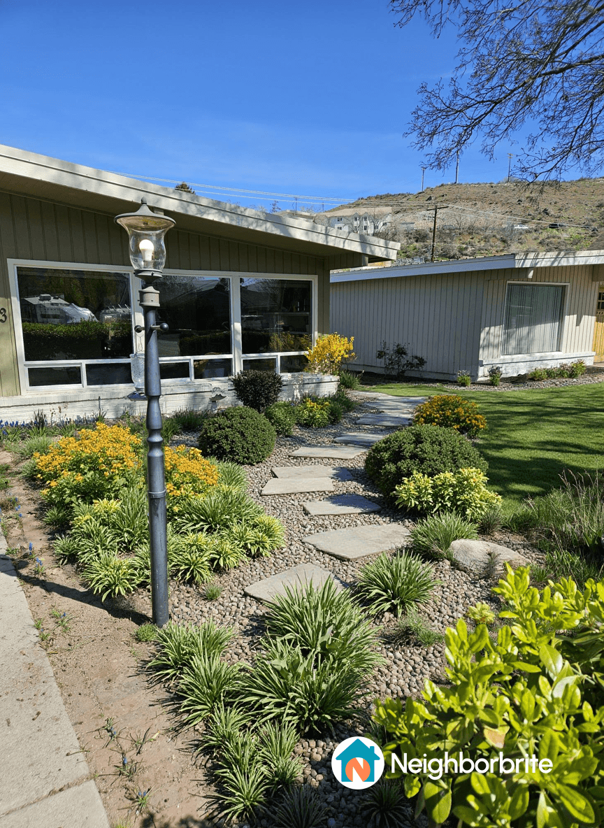 A landscaped path with native plants and a lamp in Chelan, WA.