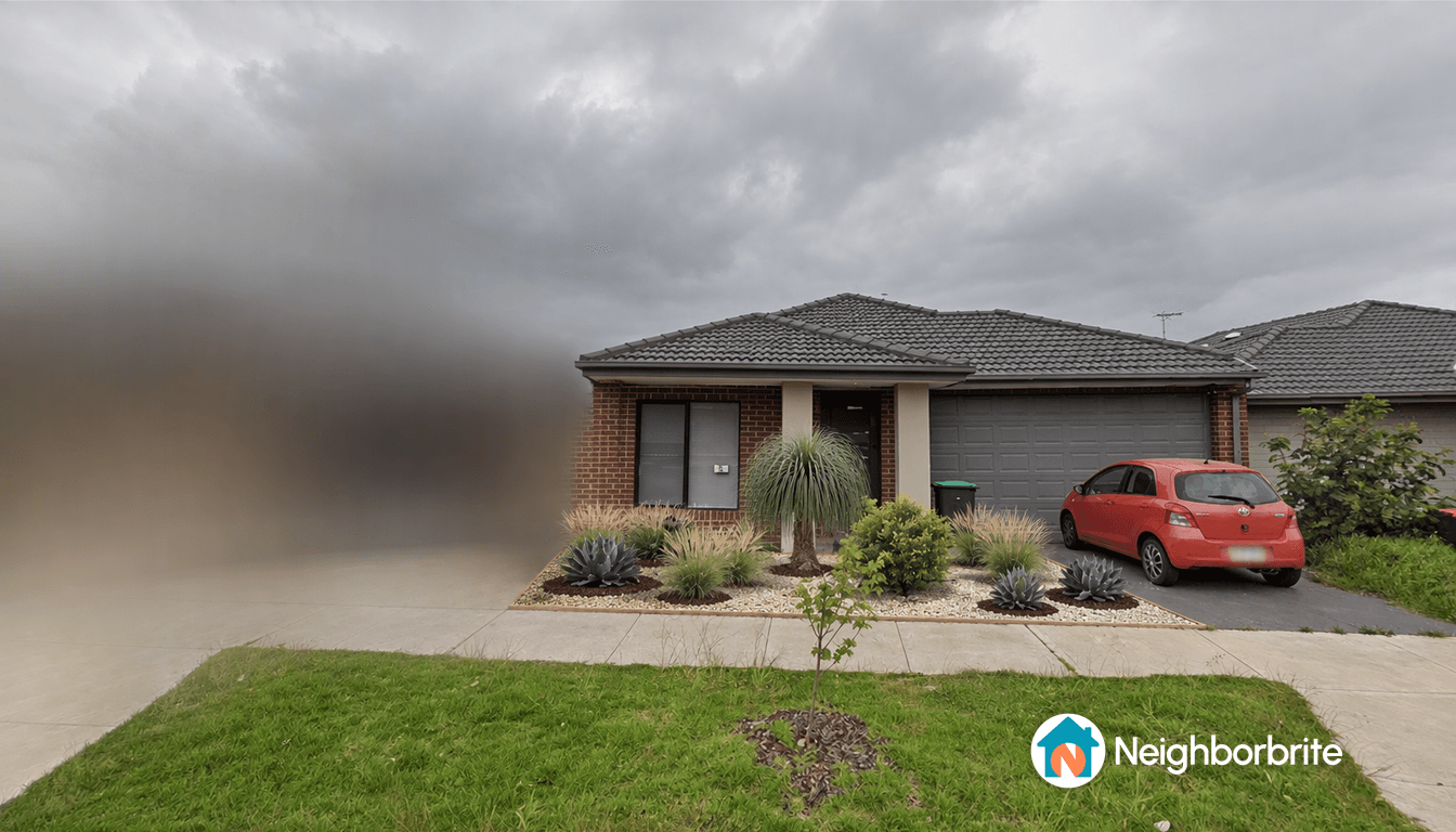 Front view of a house with garden and driveway.
