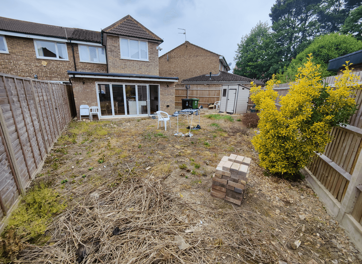 Yard space with mature trees, dining area for 8, and BBQ setup.