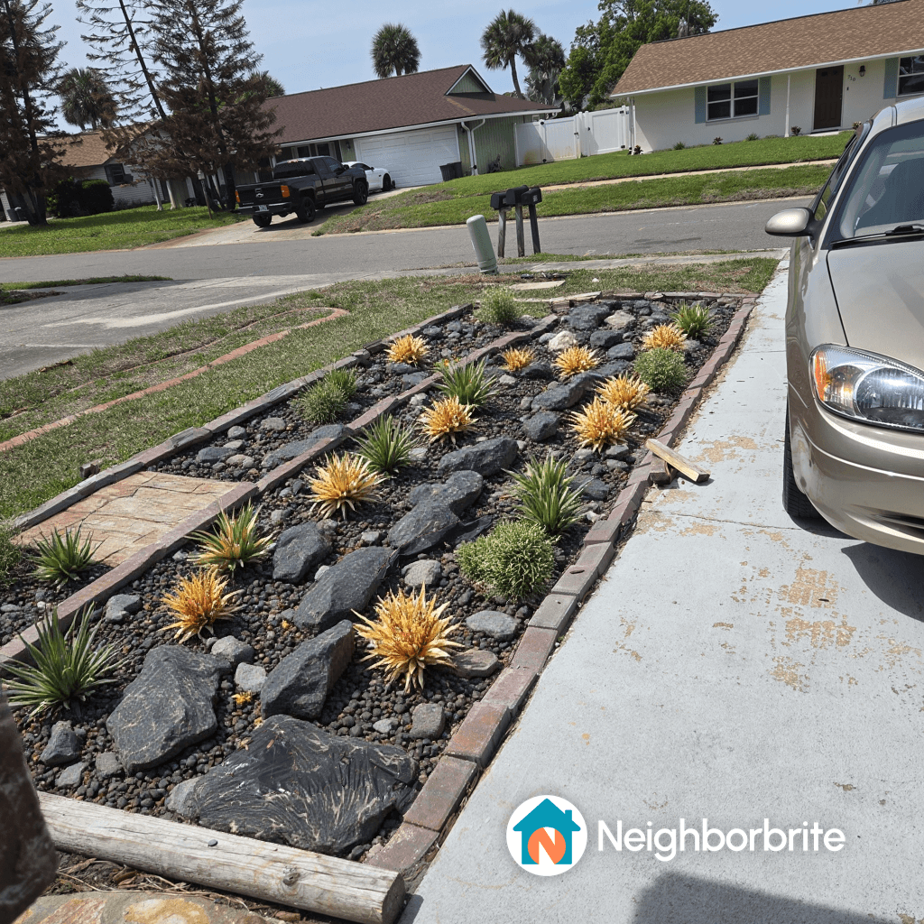 A landscaped boat pad with rocks and plants, seeking redesign suggestions.