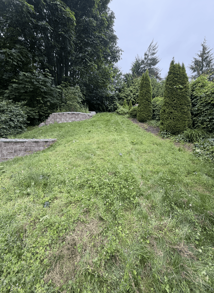 Before and after view of a yard with block steps and walls.