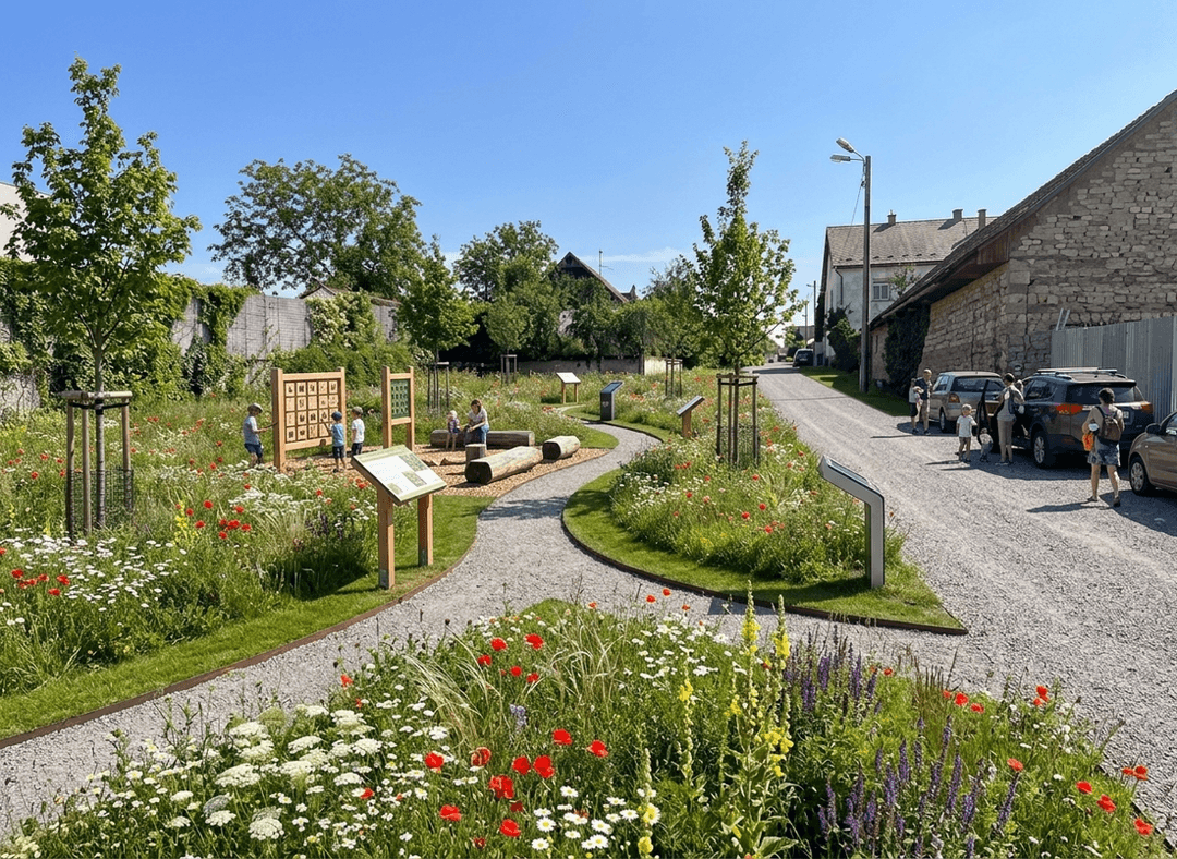 A vibrant park entrance with children playing and blooming flowers.