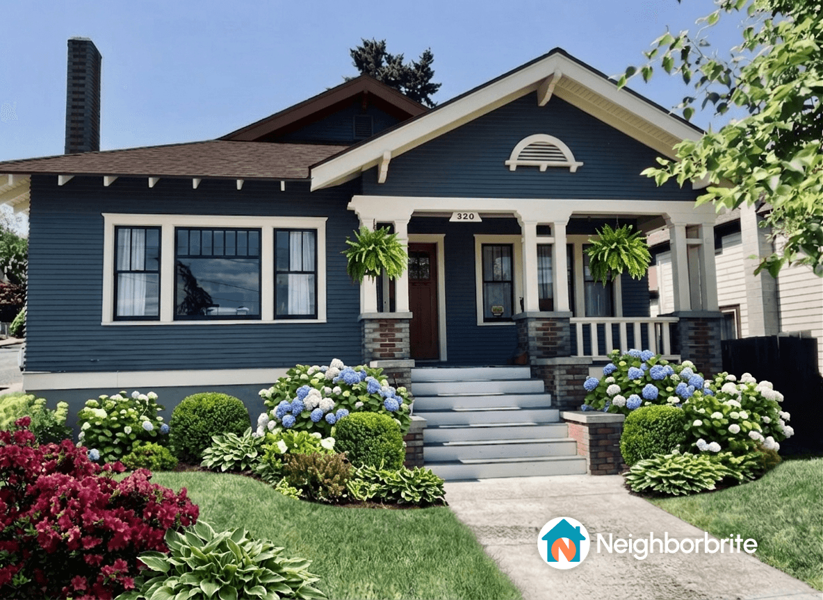 A beautiful home with hydrangeas in the garden, showcasing vibrant blooms.