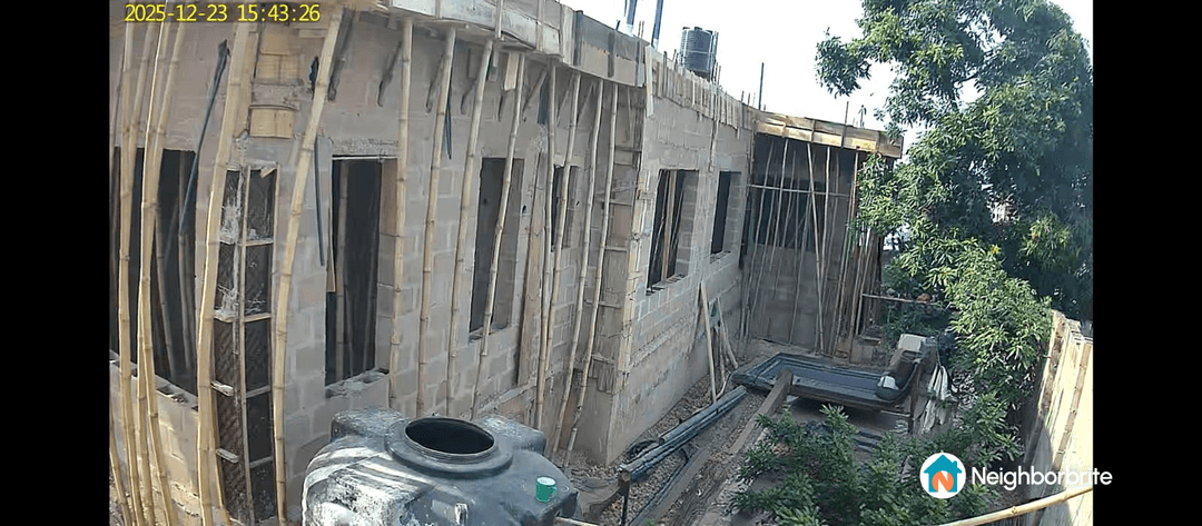 Construction site of a small side yard with a pool in West Africa.