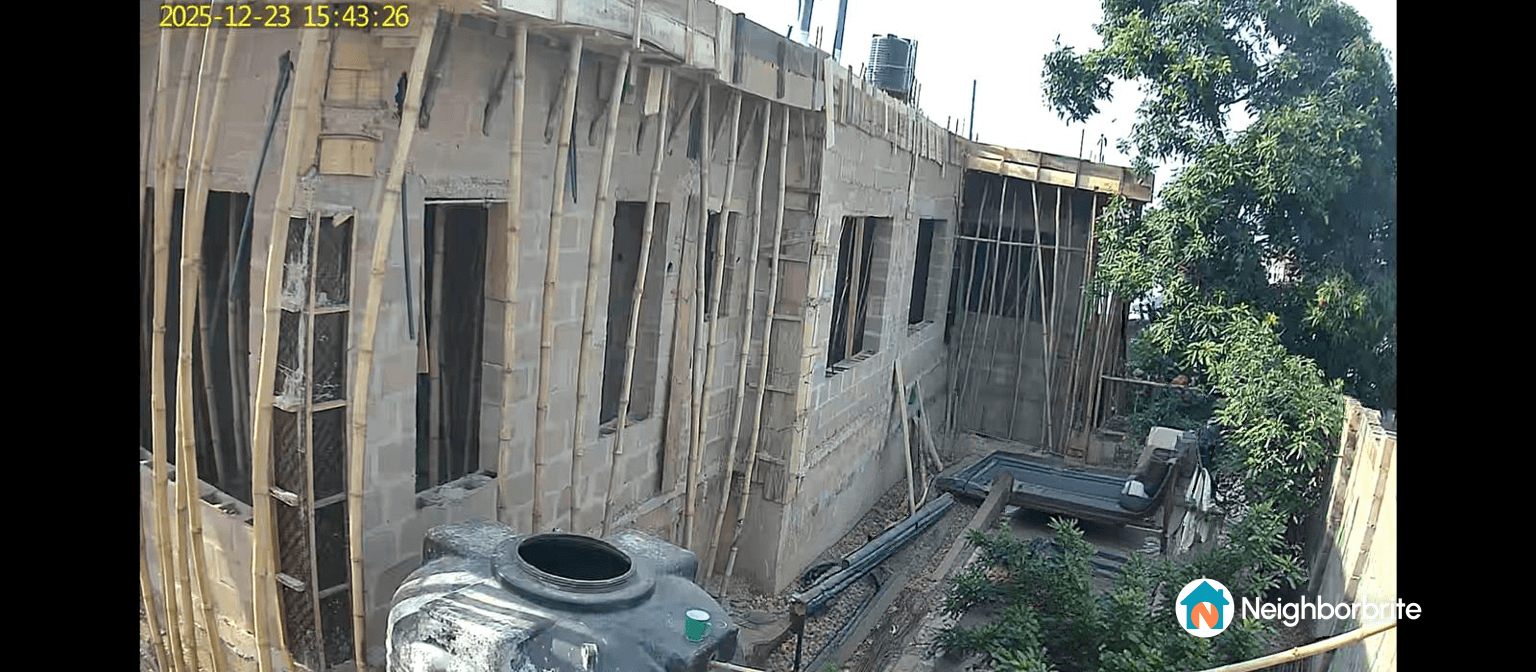 Construction site of a small side yard with a pool in West Africa.
