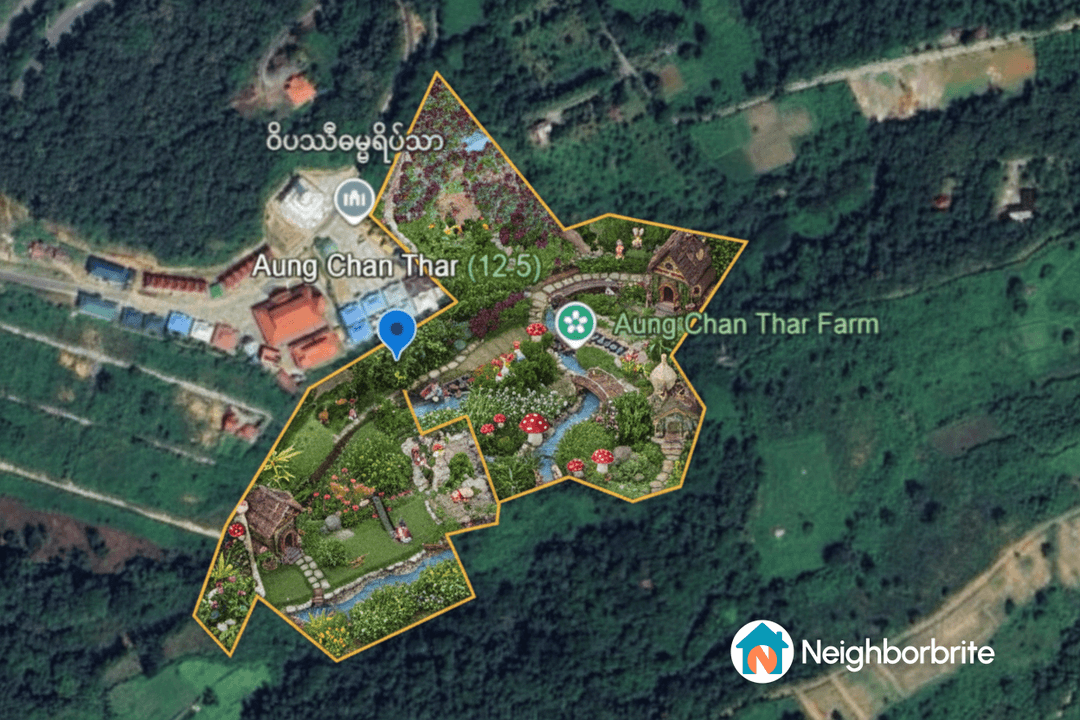 Aerial view of a landscaped area with gardens and pathways.
