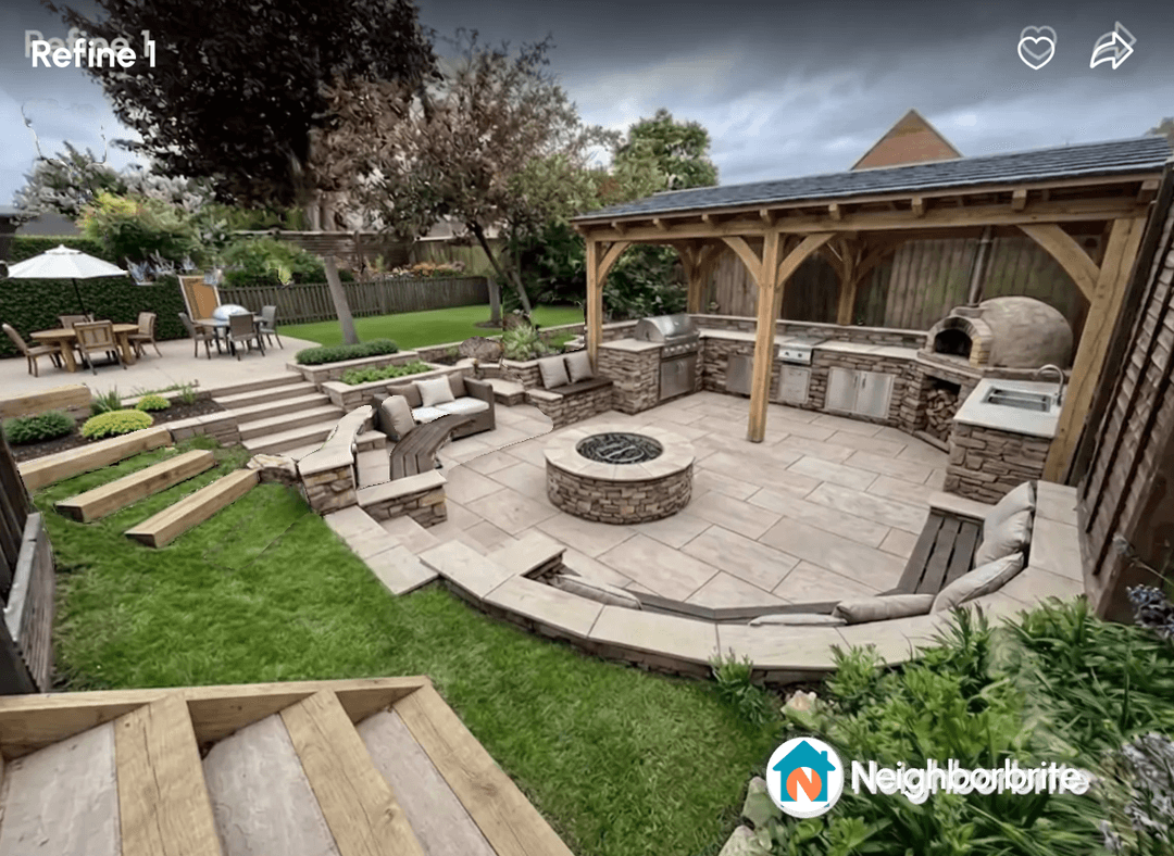 A beautifully designed outdoor space with seating, fire pit, and kitchen.
