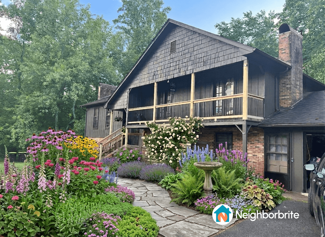 A beautiful home with a flower garden, asking about DIY material costs.