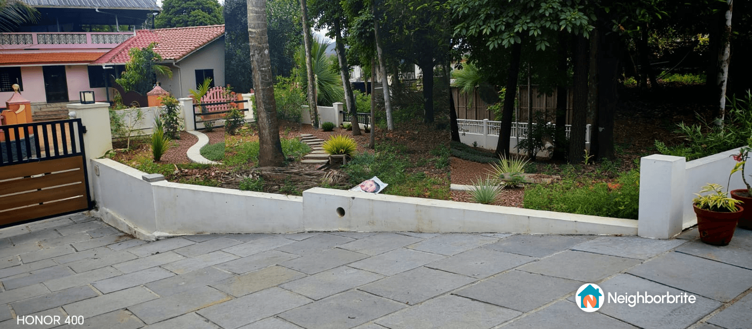 A modern yard design featuring pathways, plants, and a stylish entrance.