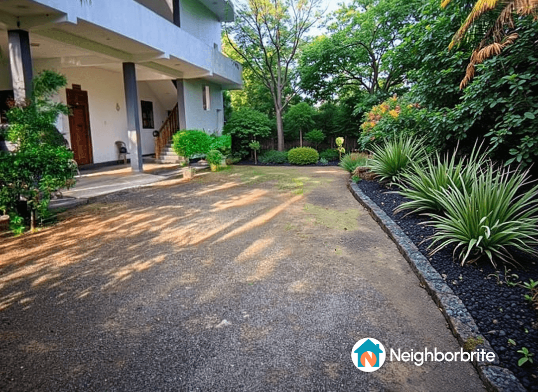A view of a landscaped yard with plants and a pathway.
