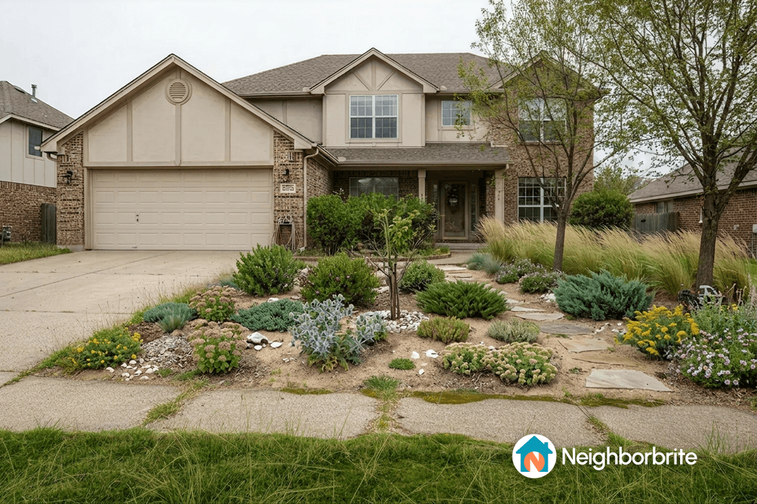 Front yard with coastal plants and landscaping features.