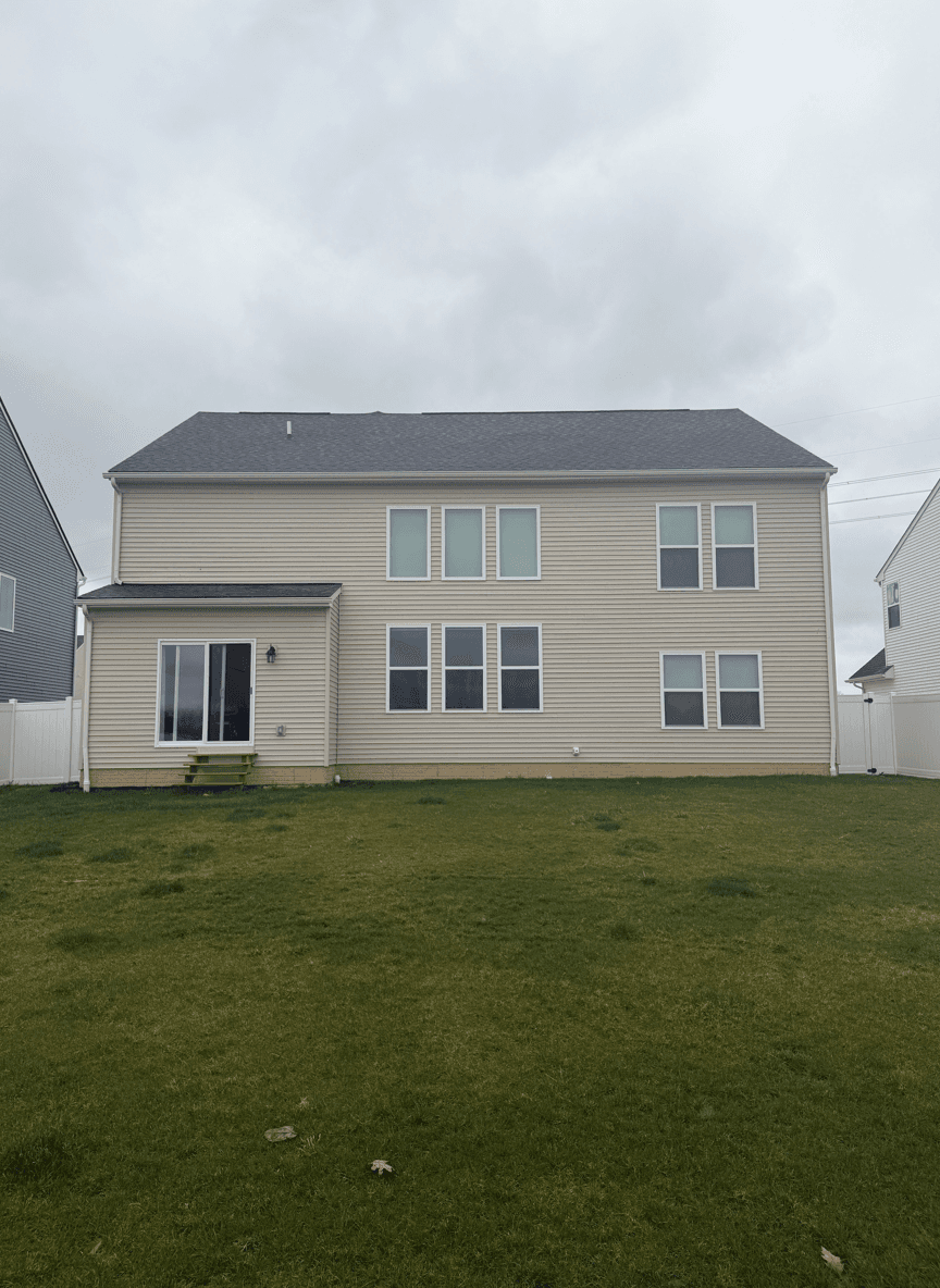 Backyard view with potential for a concrete patio and pergola.
