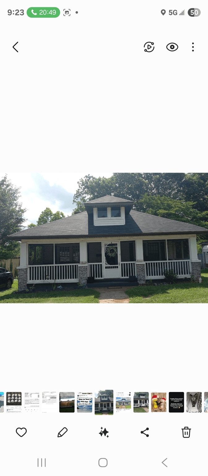 Front view of a house with a porch and greenery, looking for curb appeal suggestions.