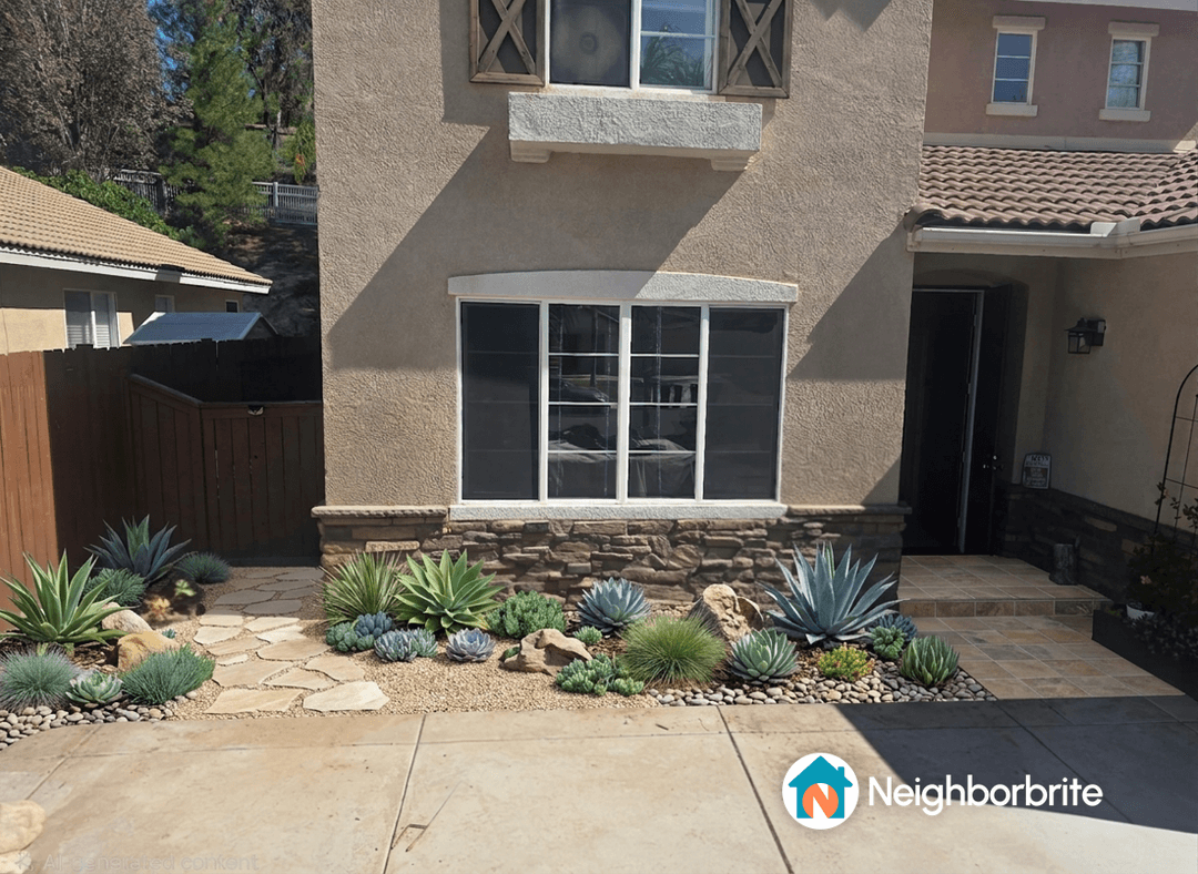 A landscaped front yard with succulents and stone pathways.