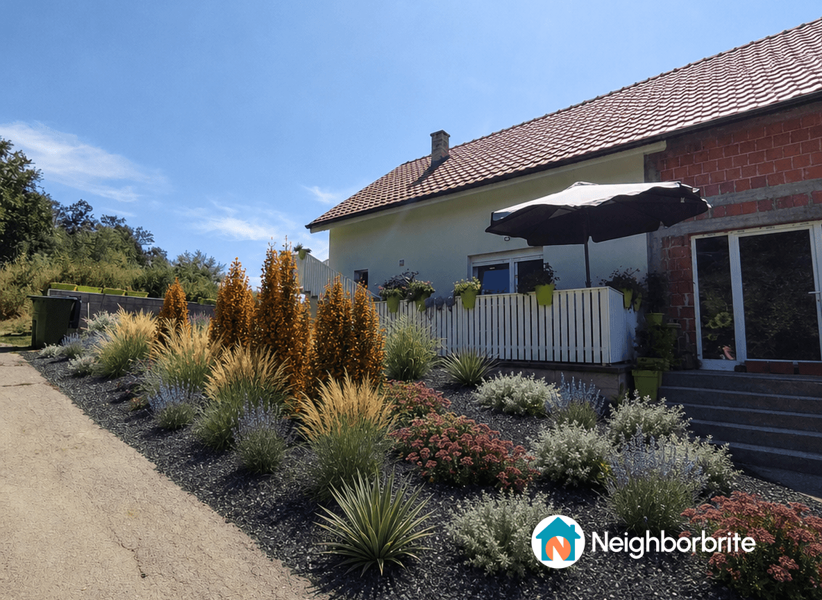A vibrant garden with colorful plants and a house in the background.