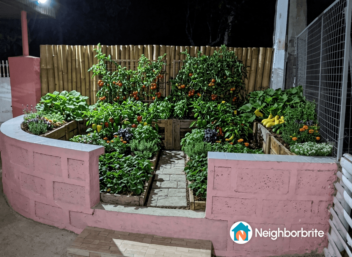 A vibrant garden with various vegetables and flowers at night.