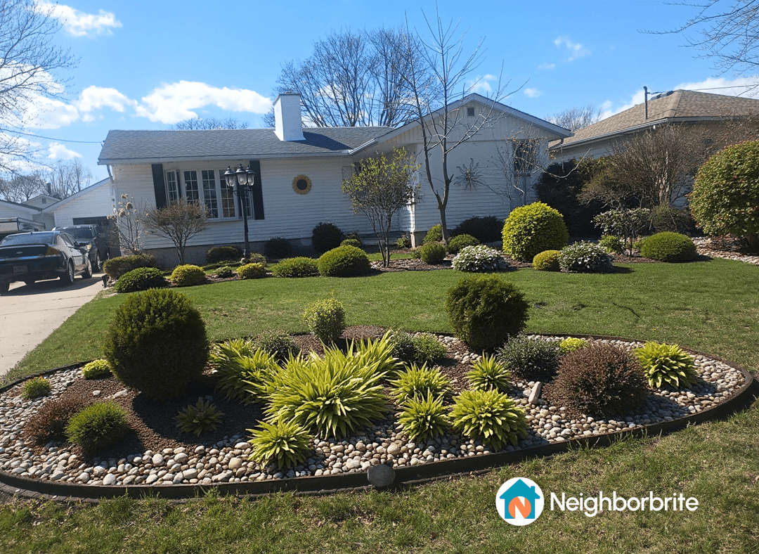 A beautifully redesigned front yard with various plants and landscaping features.