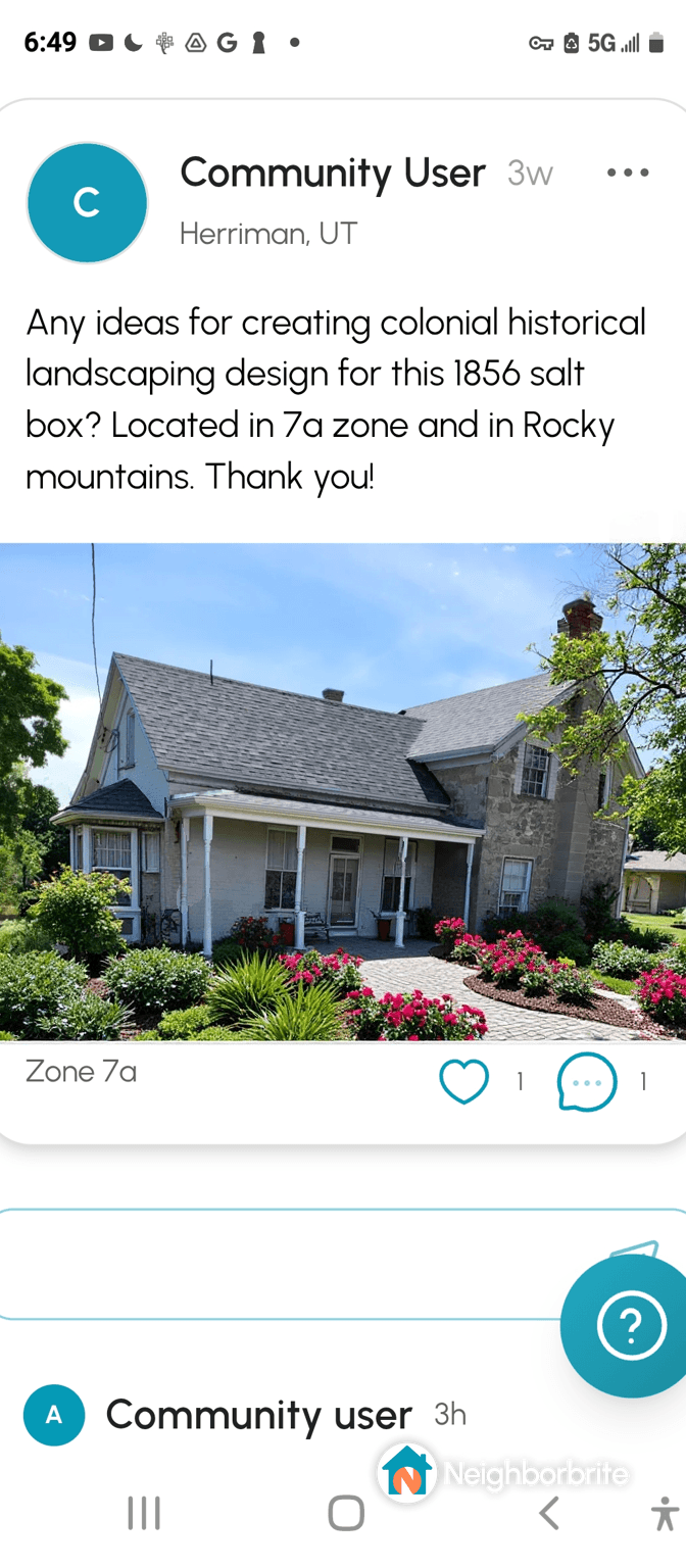 Front view of an 1856 salt box home with landscaping.