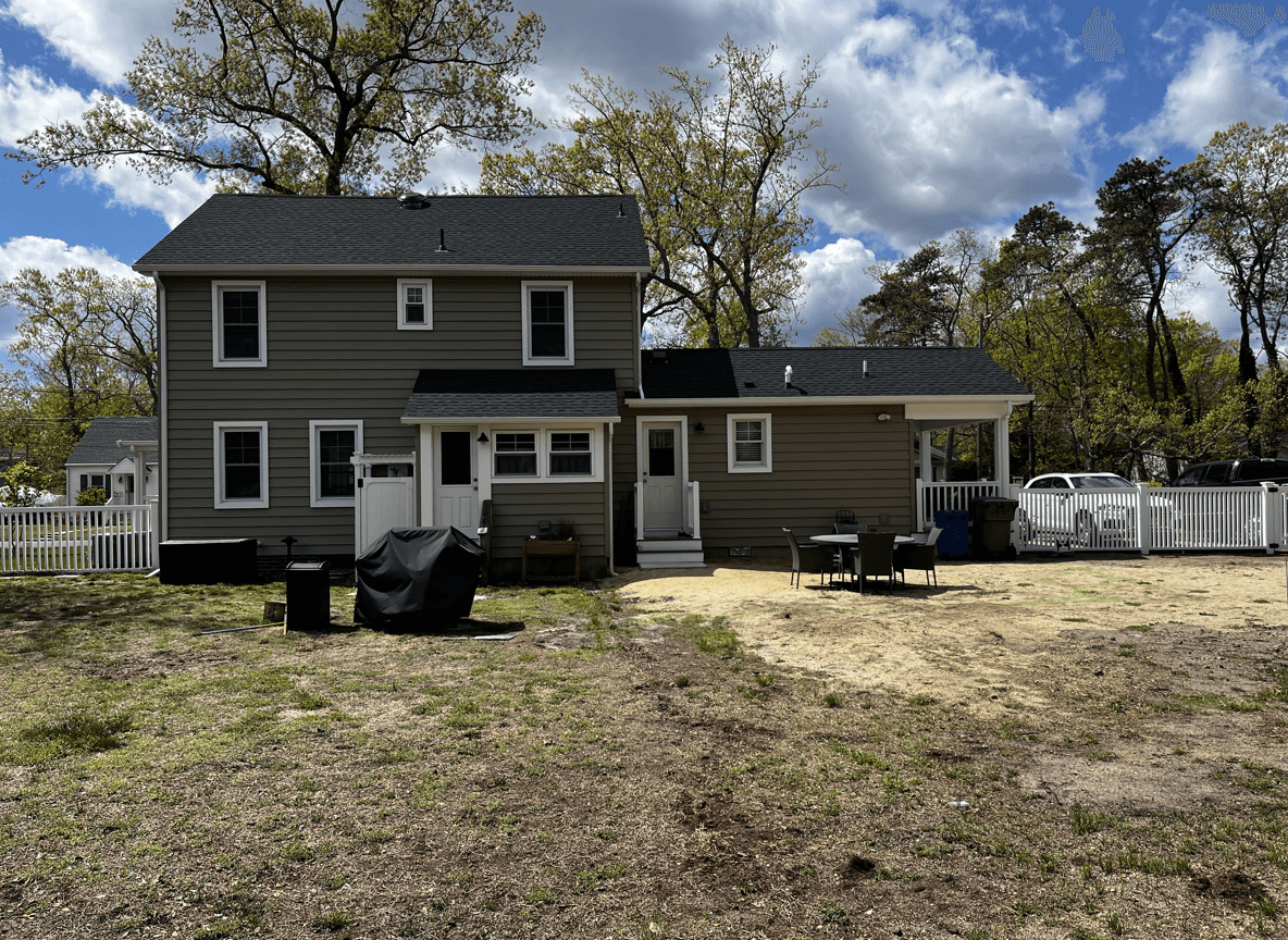 Backyard view showing space for a rectangular patio.