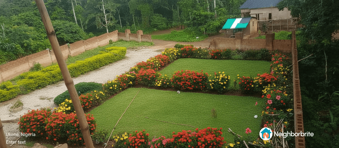 A vibrant garden with colorful flowers and green grass in Ukehe, Nigeria.