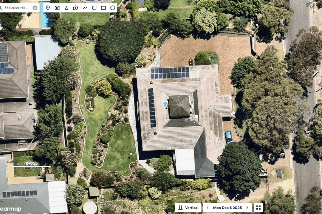 Aerial view of a backyard with potential space for a swimming pool.