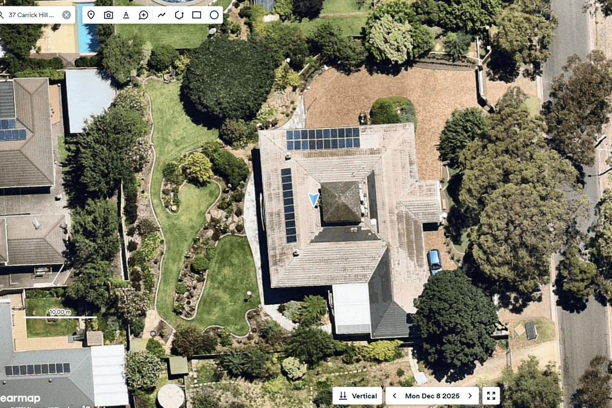 Aerial view of a backyard with potential space for a swimming pool.