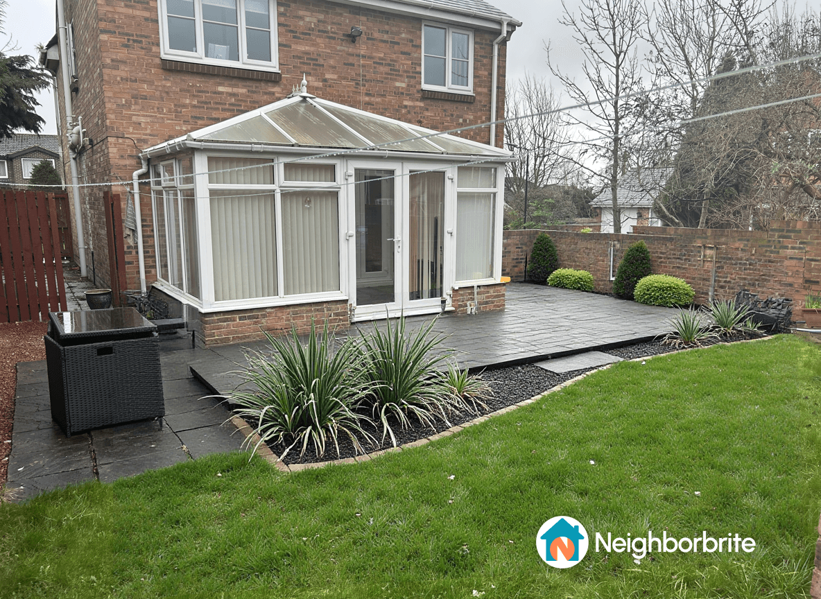 A garden featuring a seating area, low maintenance plants, and patio.