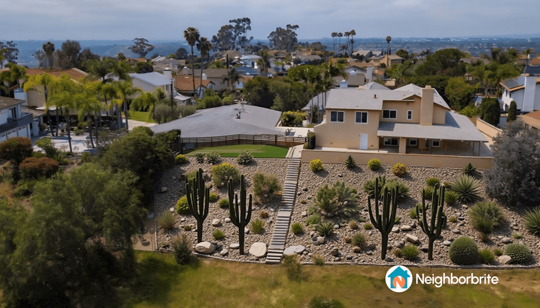 A landscaped yard featuring various cacti and plants.