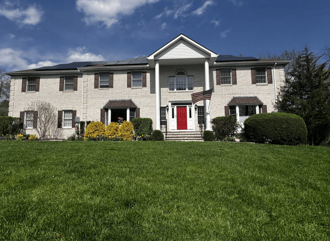 A house with solar panels, seeking design ideas to hide solar meters.