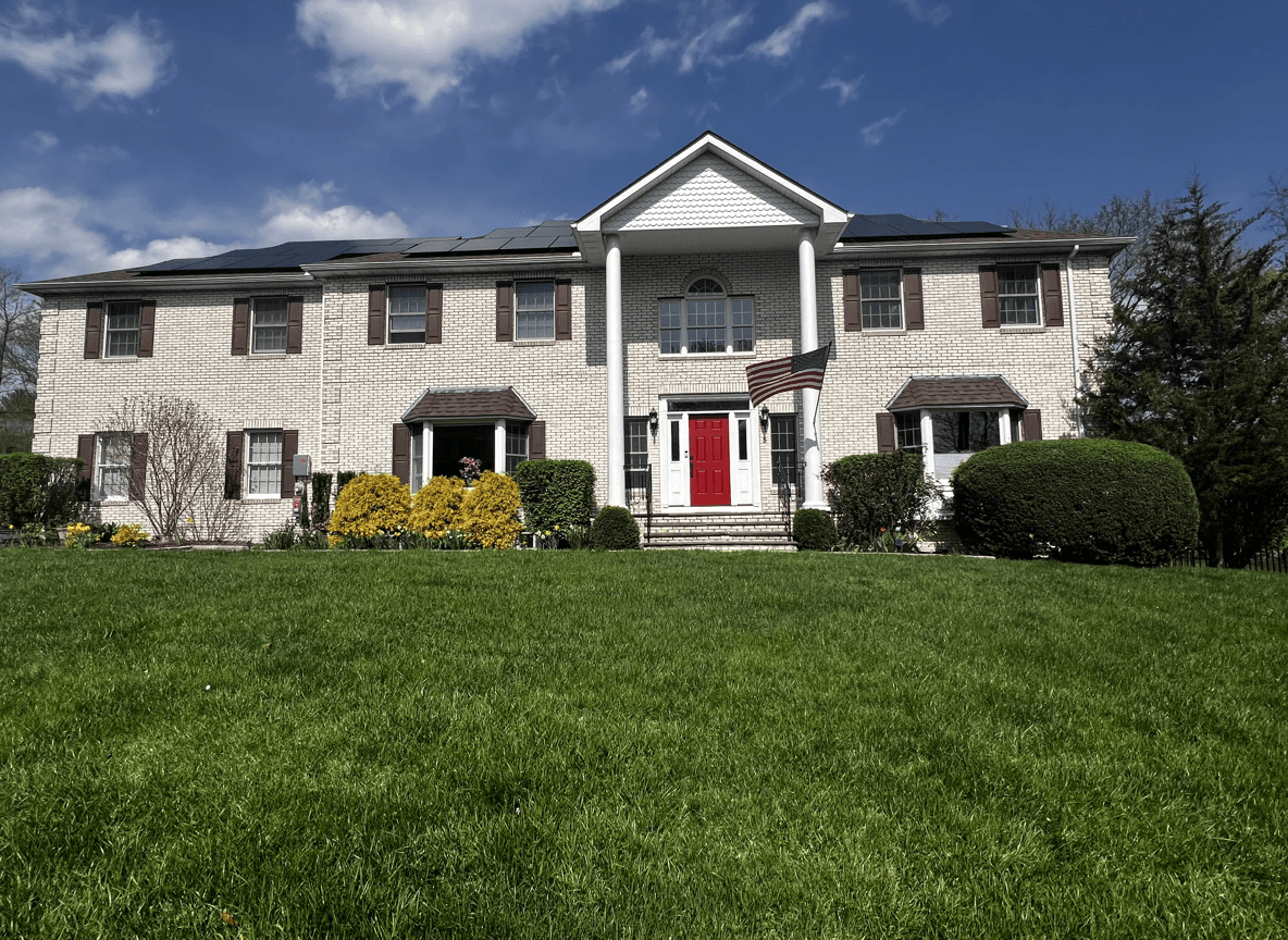 A house with solar panels, seeking design ideas to hide solar meters.