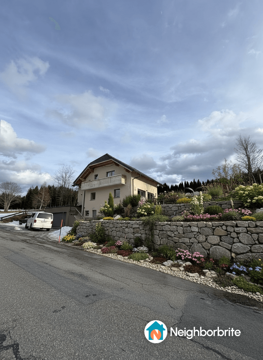 A house with a landscaped terrace, suggesting an infinity pool design.