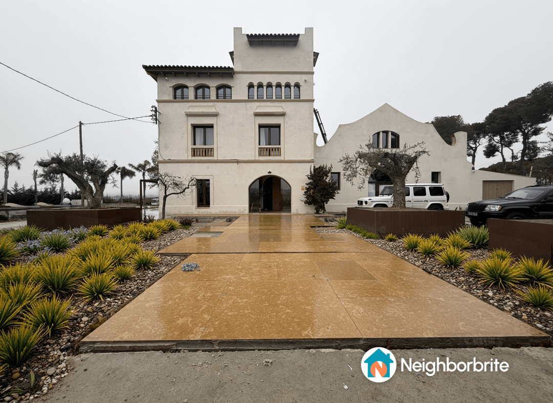 A landscaped yard featuring various plants and a modern home.