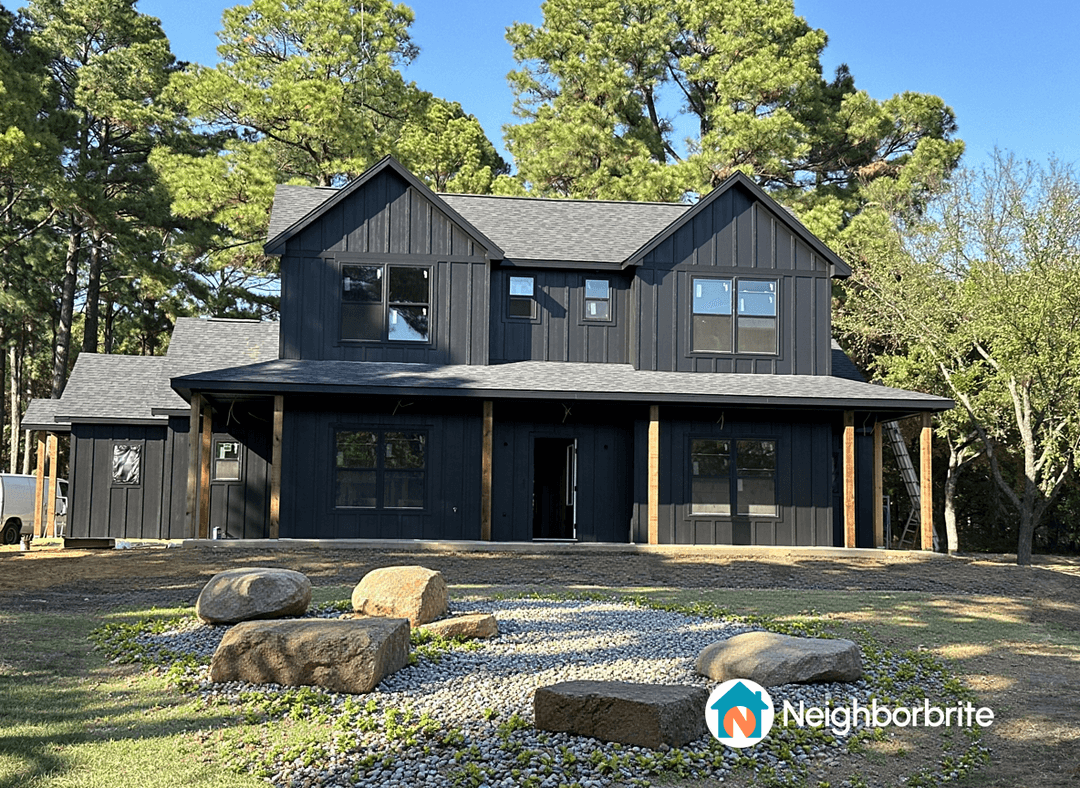 A modern house with potential flower beds and landscaping ideas.