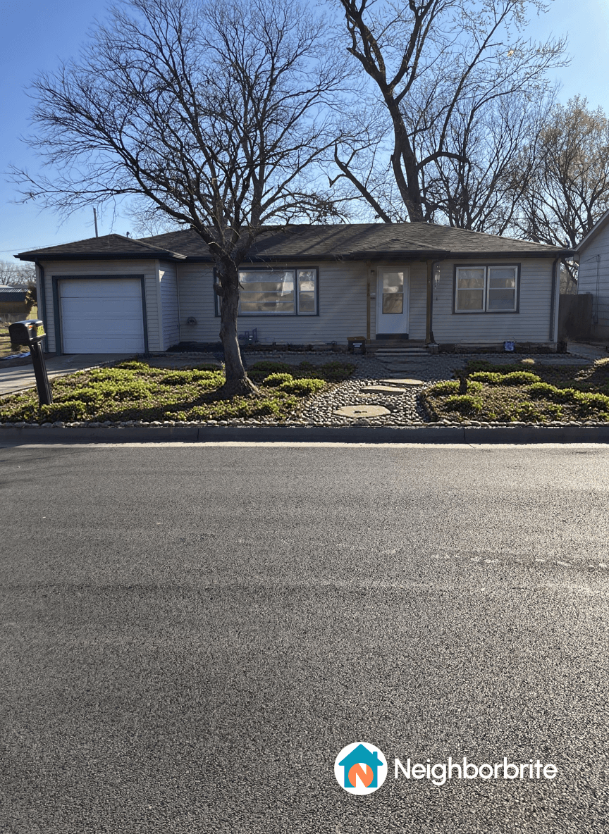 Front yard with low-maintenance landscaping and a house.