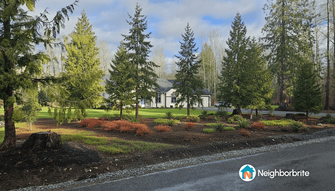 A landscaped yard with various trees and shrubs, seeking drought tolerant plant alternatives.